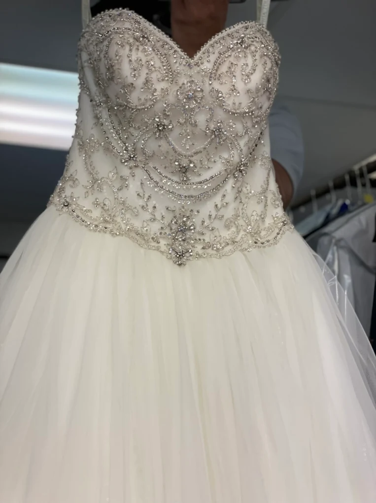Beaded wedding dress being professionally cared for at Perfecta Cleaners
