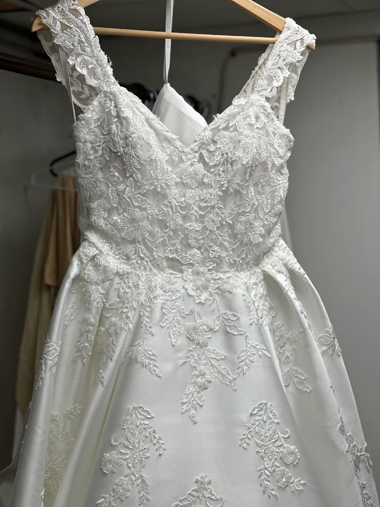 Detailed lace wedding dress professionally cared for at Perfecta Cleaners